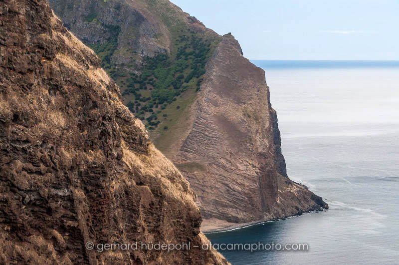 Steep coastal cliffs of Robinson Crusoe Island, seen from Salsipuedes trail